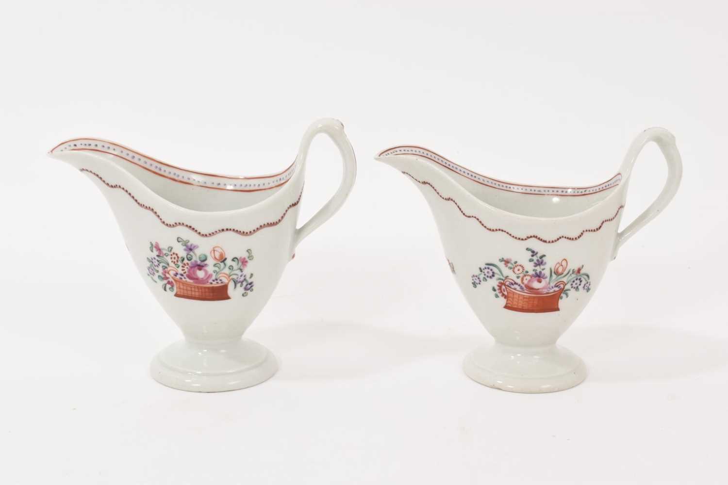 Lot 5008 - Two New Hall ‘clip handled’ helmet shaped milk jugs, circa 1785-90