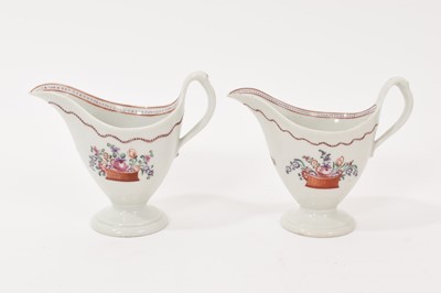 Lot 5008 - Two New Hall ‘clip handled’ helmet shaped milk jugs, circa 1785-90
