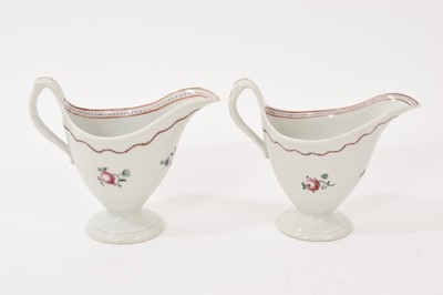 Lot 5008 - Two New Hall ‘clip handled’ helmet shaped milk jugs, circa 1785-90