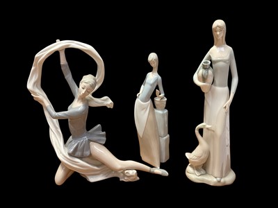 Lot 2261 - Two NAO porcelain figures, together with an unmarked figure (3)