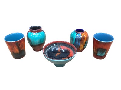 Lot 2268 - Five small piece of Poole pottery including two beakers, two vases and a pedestal bowl (5)