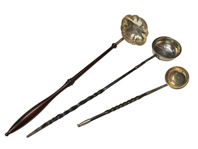 Lot 186 - Two Georgian silver toddy ladles, together with a contemporary silver toddy ladle (London 1984), (3).