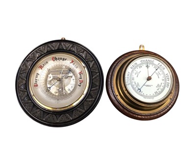 Lot 3009 - Early 20th century oak and brass bulkhead type barometer by John Barker & Co Ltd, Kensington, together with another by Spicer of Winchester, (2).