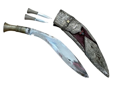 Lot 903 - Old Gurkha kukri with carved horn hilt, in velvet covered scabbard with ornate applied silver mounts, the blade 29cm in overall length.