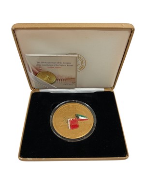 Lot 590 - Kuwait - The 50th Anniversary of The Enactment of The State of Kuwait's Constitution Golden Jubilee, gold-plated silver commemorative medallion
