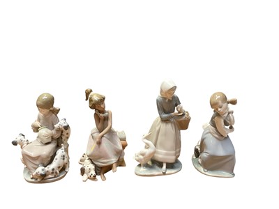 Lot 2299 - Four Lladro figures including seated girl with three Dalmatians