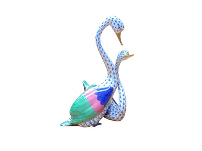 Lot 2301 - Herend porcelain model of two swans hand painted in the fishnet pattern, 19cm high