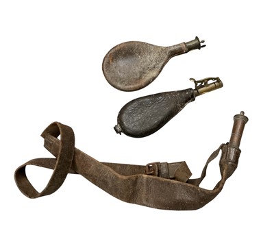 Lot 1007 - Victorian Leather powder flask together with leather shot flash on strap, brass fitting stamped Dixon