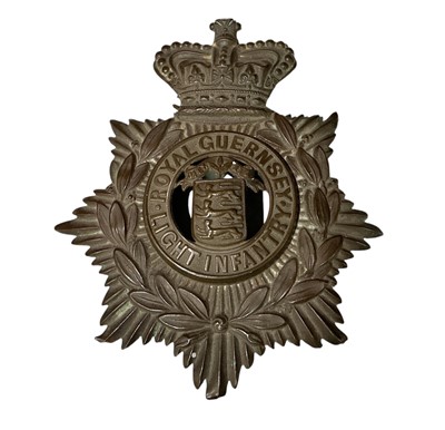 Lot 707 - Victorian other ranks Royal Guernsey Light Infantry helmet plate badge.