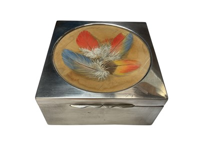 Lot 125 - Edwardian silver cigarette box of square form, with hinged cover, inset with Trompe l'oeil painting of coloured feathers (Birmingham 1907) Williams Ltd, 11.3cm x 11.3cm