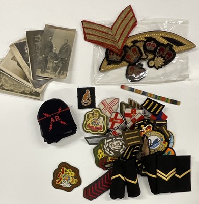 Lot 821 - Collection of various British military cloth badges to include Royal Navy, Army and a small collection on military postcards, (1 box).