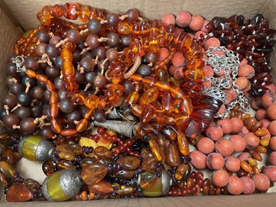 Lot 290 - Group of amber bead necklaces, other similar beads, silver mounted amber earrings etc
