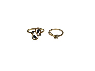 Lot 231 - Sapphire cluster ring marked 14k, size O, together with a 9ct gold crossover ring, size H (2)