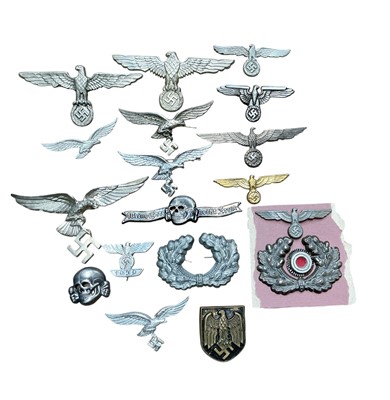 Lot 737 - Group of Nazi German cap and uniform badges.