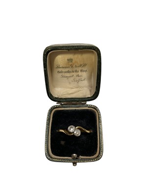 Lot 237 - 18ct gold diamond two stone cross over ring with two brilliant cut diamonds, estimated to weigh approximately 0.30cts in total, on 18ct yellow gold shank, size S½