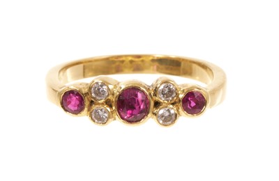 Lot 416 - Ruby and diamond seven stone cluster ring in yellow metal setting