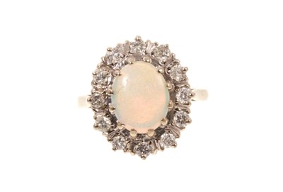 Lot 427 - 18ct white gold opal and diamond cluster ring