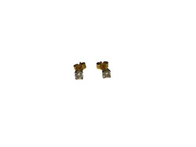 Lot 239 - Pair of diamond stud earrings, each with a brilliant cut diamond weighing approximately 0.35cts in total, in four claw setting with post and butterfly fittings