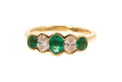 Lot 422 - Emerald and diamond five stone ring in gold setting