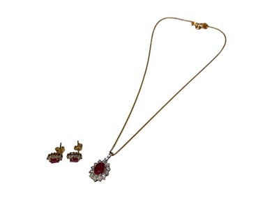 Lot 255 - 9ct white gold ruby and diamond oval cluster pendant on 9ct yellow gold chain, together with a pair of similar 9ct gold earrings