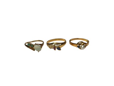 Lot 260 - Two Continental gold gem set rings, both stamped 750 and one other opal gem set ring marked 14k (3)
