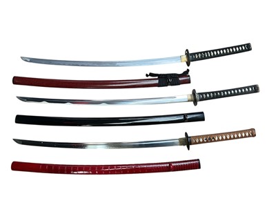 Lot 936 - Three modern Japanese Katana swords with forged blades with lacquered scabbards (3)