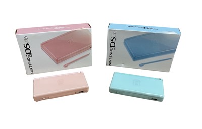 Lot 2716 - Two boxed Nintendo DS lite's in pink and blue.