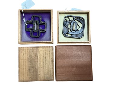 Lot 940 - Two Antique Japanese iron tsubas, one of octagonal form with reticulated shell and ship's sail decoration, signed 7.7cm square, the other of reticulated cruciform with gold inlay, 7.5 x 7cm, bo...