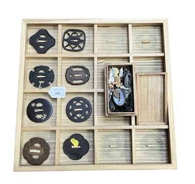 Lot 942 - Collection of eight Antique Japanese tsubas including bronze and iron examples, in display box