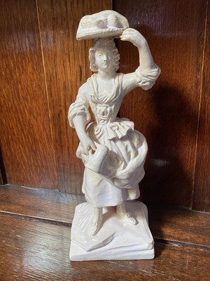 Lot 5241 - 19th century French glazed pottery figurine of a cake merchant
