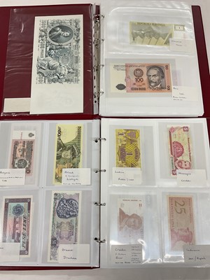 Lot 585 - World - Two albums containing mixed banknotes with examples from British Commonwealth, Europe, East Europe, South America, Africa, China, Iraq and other, mostly EF-uncirculated (289 banknotes) <...