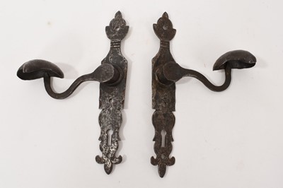 Lot 773 - Pair of Arts and Crafts cut steel door handles with keyhole escutcheon backplates leaf cup handles