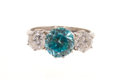 Lot 458 - Diamond and blue zircon three stone ring
