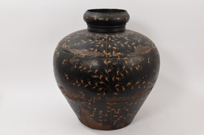 Lot 819 - Large tole metal black ground baluster vase decorated with incised figures amongst stylised foliage