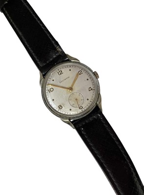 Lot 99 - 1940s German Helvetia wristwatch, the circular silvered dial with gilt numeral and dot markers, gilt hands and subsidiary seconds in a stainless steel case, 32mm diameter, marked D40216H, on a l...