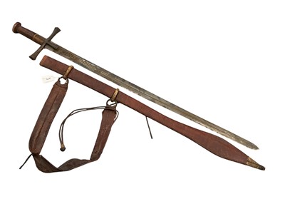 Lot 919 - Late 19th century Sudanese Kaskara sword of traditional cruciform, straight double edged blade in tooled brown leather covered sheath with swollen tip, approx 102cm