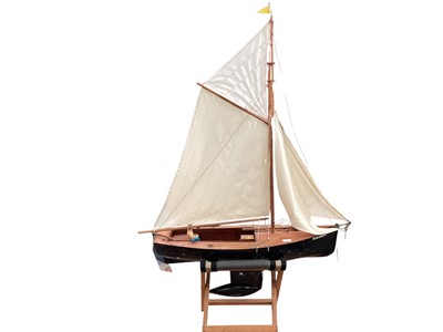 Lot 2983 - Scratch built wooden sailing boat Susannah with clinker built hull and wooden deck together with Futaba Skysport 6 remote control (not tested) , on wooden stand (1)