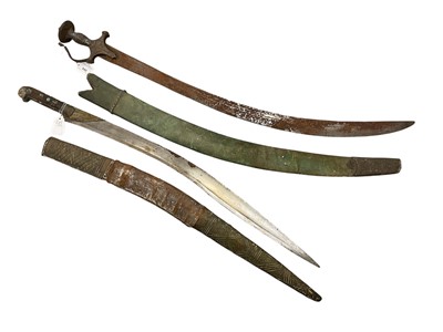 Lot 949 - 19th century Indian Tulwar with silvered iron guard, curved fullered blade in associated silver mounted scabbard and 19th century Kyber knife in scabbard (2)