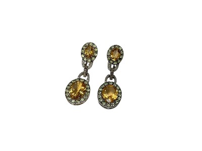Lot 219 - Pair of citrine, peridot and diamond pendant drop earrings in white gold setting, stamped 14k.
