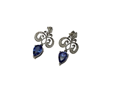 Lot 220 - Pair of 18ct white gold diamond and tanzanite pendant earrings