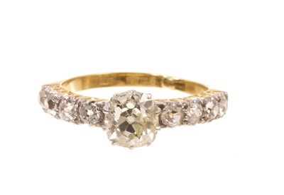 Lot 430 - Diamond single stone ring with a cushion shape old cut diamond, estimated to weigh approximately 1.07cts, in claw setting, flanked by eight old cut diamonds to the shoulders in carved gold setti...