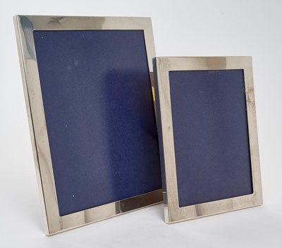 Lot 240 - Pair of contemporary silver photograph frames of plain rectangular form, with wooden easel backs