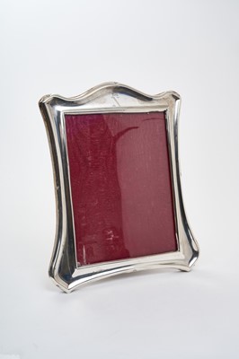 Lot 242 - Late Victorian silver photograph frame of waisted form, with engraved crown over initial N