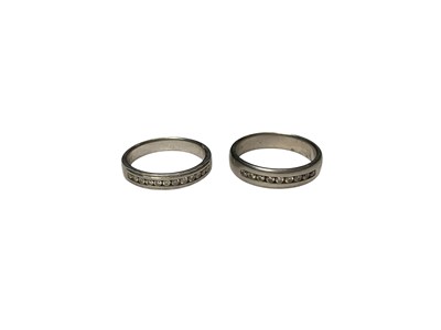 Lot 210 - Two platinum diamond set half eternity rings