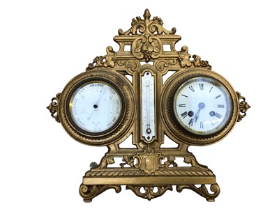 Lot 3049 - Ornate gilt barometer with a clock and thermometer measuring 35.5cm