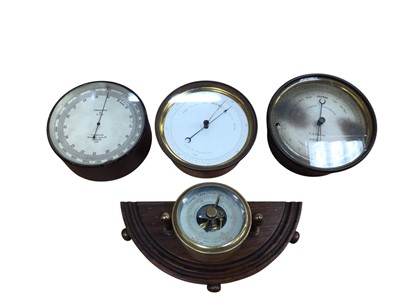 Lot 3056 - Group of four aneroid barometers, one with the broad arrow mark