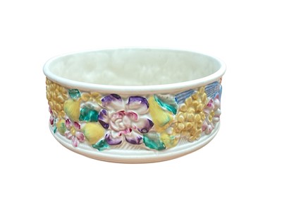 Lot 2349 - Clarice Cliff for Newport Pottery bowl, decorated in relief with birds and flowers, 20cm diameter