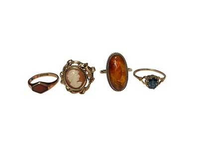 Lot 275 - 1920s 9ct gold signet ring, 9ct gold cameo ring, 9ct gold amber ring and one other 9ct gold gem set ring (4)