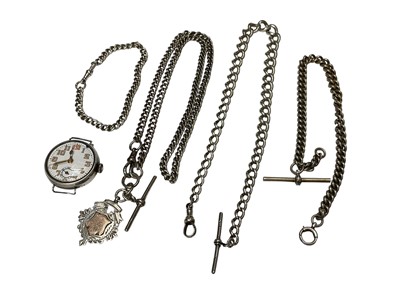Lot 281 - 1920s silver cased watch, three silver watch chains, one with a silver fob and a plated watch chain
