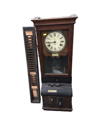 Lot 3062 - Late 19th century clocking in clock in oak case with card holder